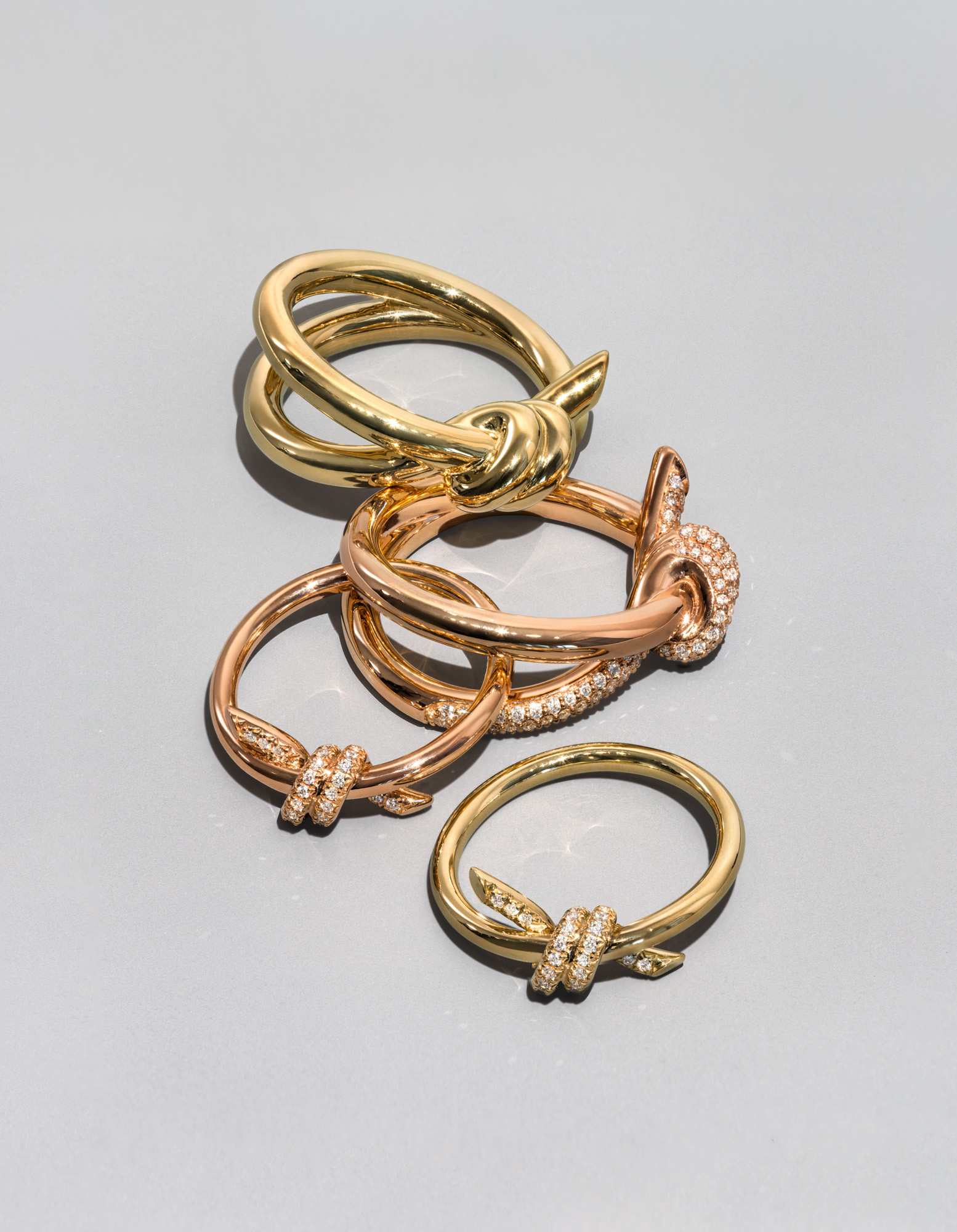 18k yellow and rose gold Tiffany Knot rings with and without pavé